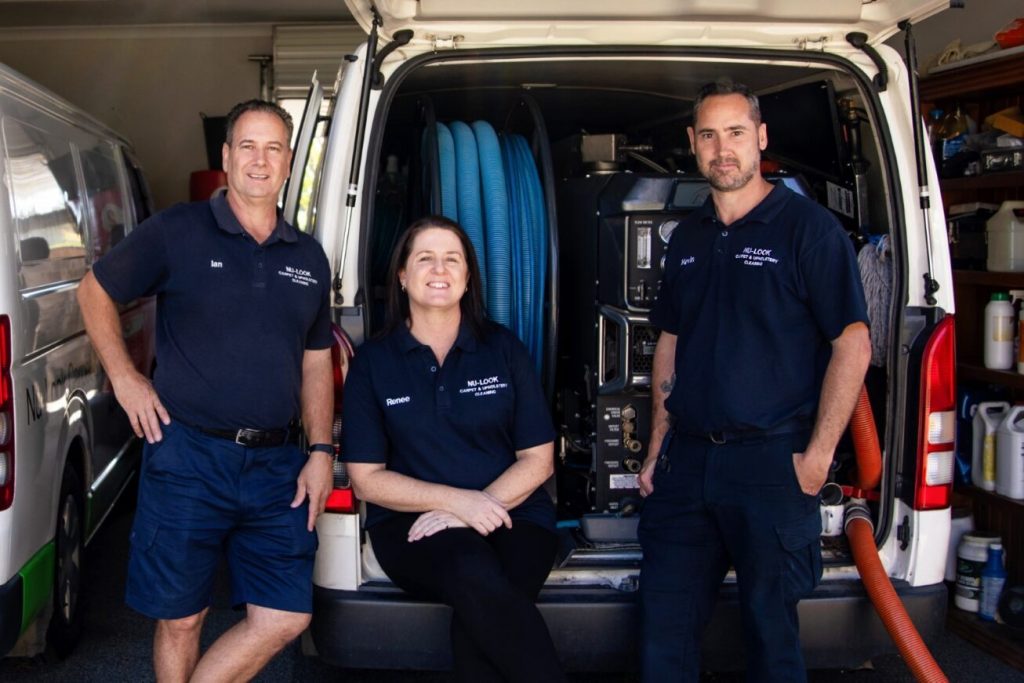 The Nu-Look team standing at the back of their fully equipped carpet cleaning van