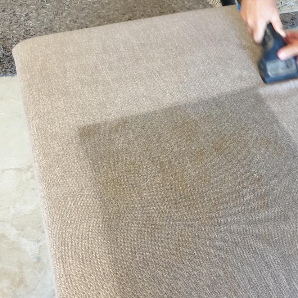 Fabric lounge suite being professionally cleaned